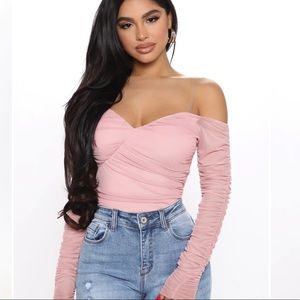 A hot mesh body suit in mauve